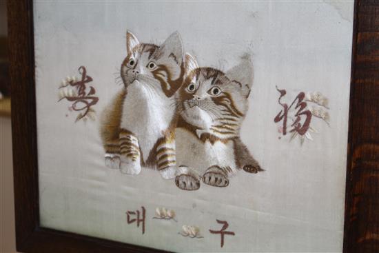 An early 20th century Japanese silkwork panel of two kittens, mounted as an oak firescreen, panel 40 x 43cm